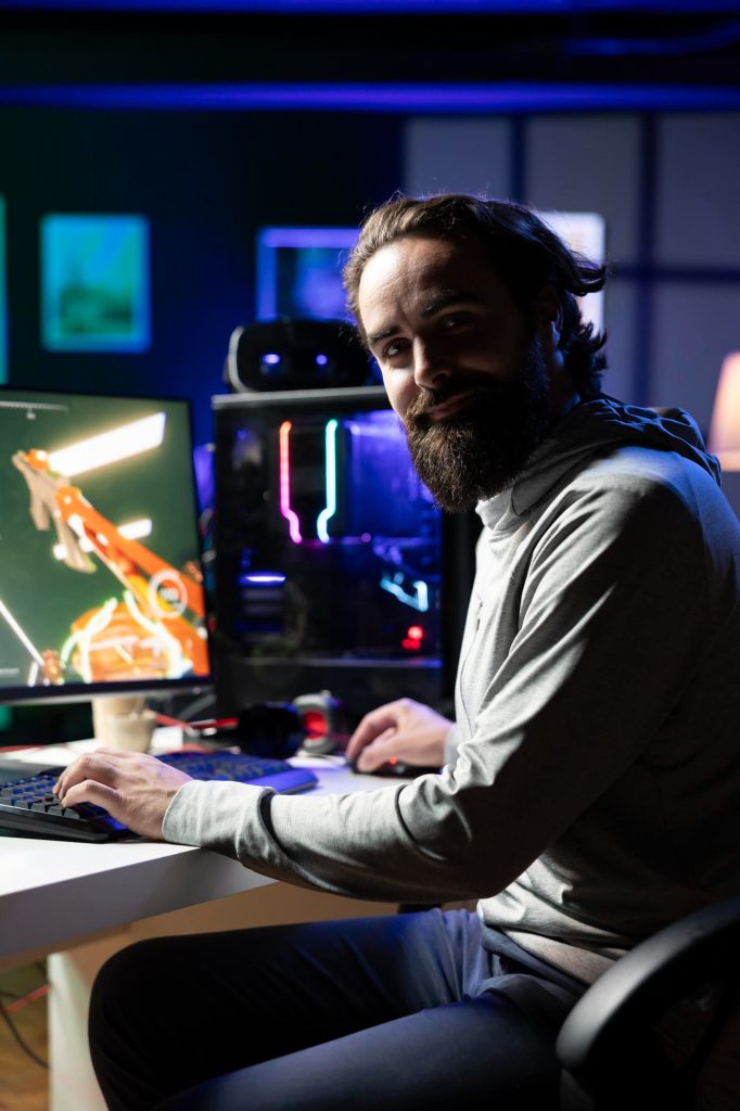 Game developer working at a gaming setup